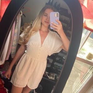 Cream, satin-like romper from Express